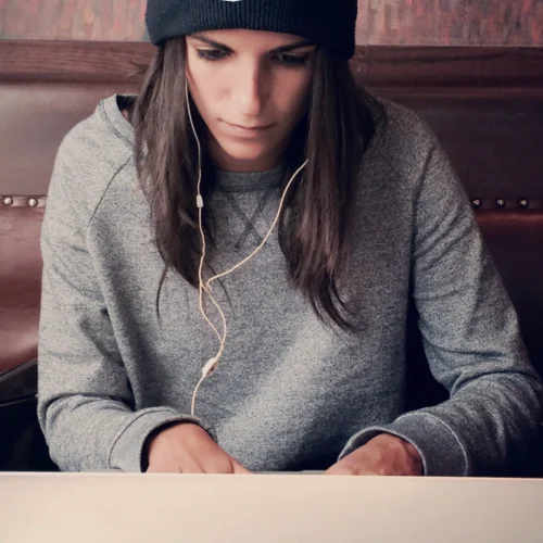 Woman types on laptop