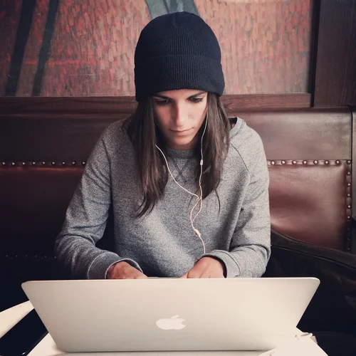 Woman writes on laptop